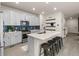Modern kitchen showcasing a large island, ample storage, and sleek stainless steel appliances at 4343 S Nepal Ct, Centennial, CO 80015
