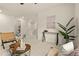 Spacious living room with a modern console table, stylish seating, and plenty of natural light at 4343 S Nepal Ct, Centennial, CO 80015