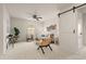 Open-concept living room with comfortable seating, stylish decor, and a sliding barn door at 4343 S Nepal Ct, Centennial, CO 80015
