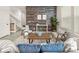 Comfortable living room featuring a trendy accent wall, neutral palette, and lots of natural light at 4343 S Nepal Ct, Centennial, CO 80015