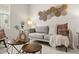 Cozy living room featuring a comfortable sofa, textured pillows, and stylish coffee tables at 4343 S Nepal Ct, Centennial, CO 80015
