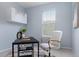 Home office featuring modern furnishings, including a black desk, white chair, and stylish decor at 4343 S Nepal Ct, Centennial, CO 80015
