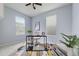 Bright office featuring a sleek desk, comfortable chair, and ample natural light from the windows at 4343 S Nepal Ct, Centennial, CO 80015