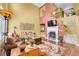 Inviting living room boasts a fireplace, a well-appointed seating arrangement, and tasteful decor at 9218 Viaggio Way, Highlands Ranch, CO 80126