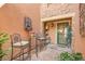 Relaxing outdoor area with comfortable seating, unique fountain and decor, and lovely landscaping at 9218 Viaggio Way, Highlands Ranch, CO 80126