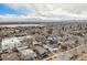 Panoramic aerial view of a neighborhood showcasing tree-lined streets and mountain views at 4440 W Hayward Pl, Denver, CO 80212