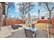 Backyard patio with outdoor seating and a black and white umbrella, perfect for entertaining at 4440 W Hayward Pl, Denver, CO 80212