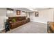 Finished basement offering a spacious seating area with large couch at 4440 W Hayward Pl, Denver, CO 80212