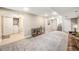 Finished basement area, showcasing carpet flooring and neutral-tone walls at 4440 W Hayward Pl, Denver, CO 80212