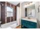 Bathroom featuring a vanity with sink and a bathtub/shower combo at 4440 W Hayward Pl, Denver, CO 80212