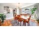 Bright dining room with a large window and views into the modern kitchen space at 4440 W Hayward Pl, Denver, CO 80212