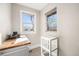 Bright office space featuring large windows and a combination of wood and glass shelving at 4440 W Hayward Pl, Denver, CO 80212