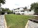 Expansive backyard featuring a lush lawn, deck, and garden bed, perfect for outdoor activities at 3262 S Salida Way, Aurora, CO 80013