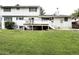 Large, grassy backyard with a deck, perfect for outdoor entertaining at 3262 S Salida Way, Aurora, CO 80013