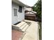 A well-kept yard with concrete patio, steps to door, and a view of the backyard fence at 3262 S Salida Way, Aurora, CO 80013