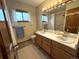 Bright bathroom featuring a double sink vanity and a shower-tub combination at 3262 S Salida Way, Aurora, CO 80013