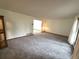 Bright living room with carpet floors and big windows to enjoy natural light at 3262 S Salida Way, Aurora, CO 80013