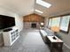 Cozy living room with a fireplace, skylights, and comfortable seating at 3262 S Salida Way, Aurora, CO 80013
