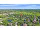 An aerial view shows the property's location nestled in a green neighborhood with a community park and pond at 5746 Aspen Creek Dr, Broomfield, CO 80020