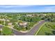 Aerial view of a neighborhood featuring mature trees and a nearby school at 5746 Aspen Creek Dr, Broomfield, CO 80020