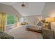 Bright bedroom with vaulted ceiling, neutral decor and large sunlit window at 5746 Aspen Creek Dr, Broomfield, CO 80020