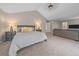 Generously sized bedroom featuring neutral carpet and ceiling fan at 5746 Aspen Creek Dr, Broomfield, CO 80020