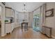 Bright breakfast nook featuring a bay window, modern light fixture, and sliding doors to the outdoor area at 5746 Aspen Creek Dr, Broomfield, CO 80020