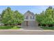 Attractive home featuring a three-car garage and well-maintained landscaping at 5746 Aspen Creek Dr, Broomfield, CO 80020