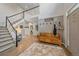 Spacious foyer featuring a staircase and a welcoming bench with coat hooks at 5746 Aspen Creek Dr, Broomfield, CO 80020