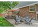Cozy outdoor patio with a fire pit, comfortable seating, and a gazebo at 5746 Aspen Creek Dr, Broomfield, CO 80020