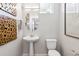 Elegant powder room with modern fixtures, decorative mirror, and stylish accents at 1348 S Boston Ct # A, Denver, CO 80247