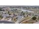 Aerial view highlighting the home's location near a pond, major roads, and other homes at 16500 Crosby Dr, Broomfield, CO 80023