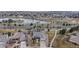 An aerial view showcases the home's proximity to green spaces, the pond and the community at 16500 Crosby Dr, Broomfield, CO 80023