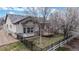 Aerial view of a fenced backyard with a deck and views of mature landscaping at 16500 Crosby Dr, Broomfield, CO 80023
