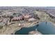 Aerial view features community clubhouse, pond, and meticulously maintained landscaping at 16500 Crosby Dr, Broomfield, CO 80023