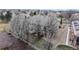 Aerial view of a single-Gathering home showcasing a well-maintained yard with flowering trees at 16500 Crosby Dr, Broomfield, CO 80023