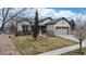 Well-maintained front yard leading to a charming home with a two-car garage at 16500 Crosby Dr, Broomfield, CO 80023