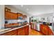 Well-appointed kitchen showcasing granite countertops, stainless steel appliances, and wood cabinetry at 16500 Crosby Dr, Broomfield, CO 80023