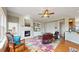 Cozy living room with fireplace, built-in shelving, and comfortable seating arrangement with natural light at 16500 Crosby Dr, Broomfield, CO 80023