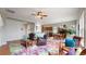 Spacious living room and dining area featuring wood floors and a colorful accent rug at 16500 Crosby Dr, Broomfield, CO 80023