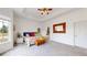 Spacious main bedroom featuring a tray ceiling, colorful accents, and ensuite bath at 16500 Crosby Dr, Broomfield, CO 80023