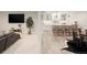 Finished basement featuring a wet bar, seating and a adjacent to a living area at 6123 Chester Way, Denver, CO 80238