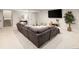 Finished basement featuring a large sectional sofa, plush carpet and recessed lighting at 6123 Chester Way, Denver, CO 80238