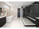 Luxurious bathroom featuring a soaking tub, glass shower, and elegant fixtures, creating a spa-like retreat at 6123 Chester Way, Denver, CO 80238
