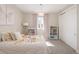 Bright bedroom with butterfly themed decor, plush bedding, and a light fixture at 6123 Chester Way, Denver, CO 80238