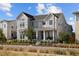 Charming two-story home with a welcoming front porch and professionally landscaped front yard, perfect for curb appeal at 6123 Chester Way, Denver, CO 80238