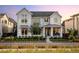 Stunning two-story home with gray siding, manicured landscaping and inviting front porch at 6123 Chester Way, Denver, CO 80238