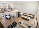 Expansive open-concept living area with modern kitchen, dining, and living spaces, perfect for entertaining and Gathering living at 6123 Chester Way, Denver, CO 80238