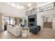 Bright living room with high ceilings, modern decor, and seamless indoor-outdoor living at 6123 Chester Way, Denver, CO 80238