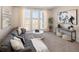 Comfortable living room with neutral decor and large windows overlooking the neighborhood at 6123 Chester Way, Denver, CO 80238